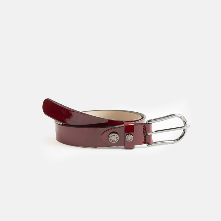 burgundy patent leather belt with silver buckle and stud