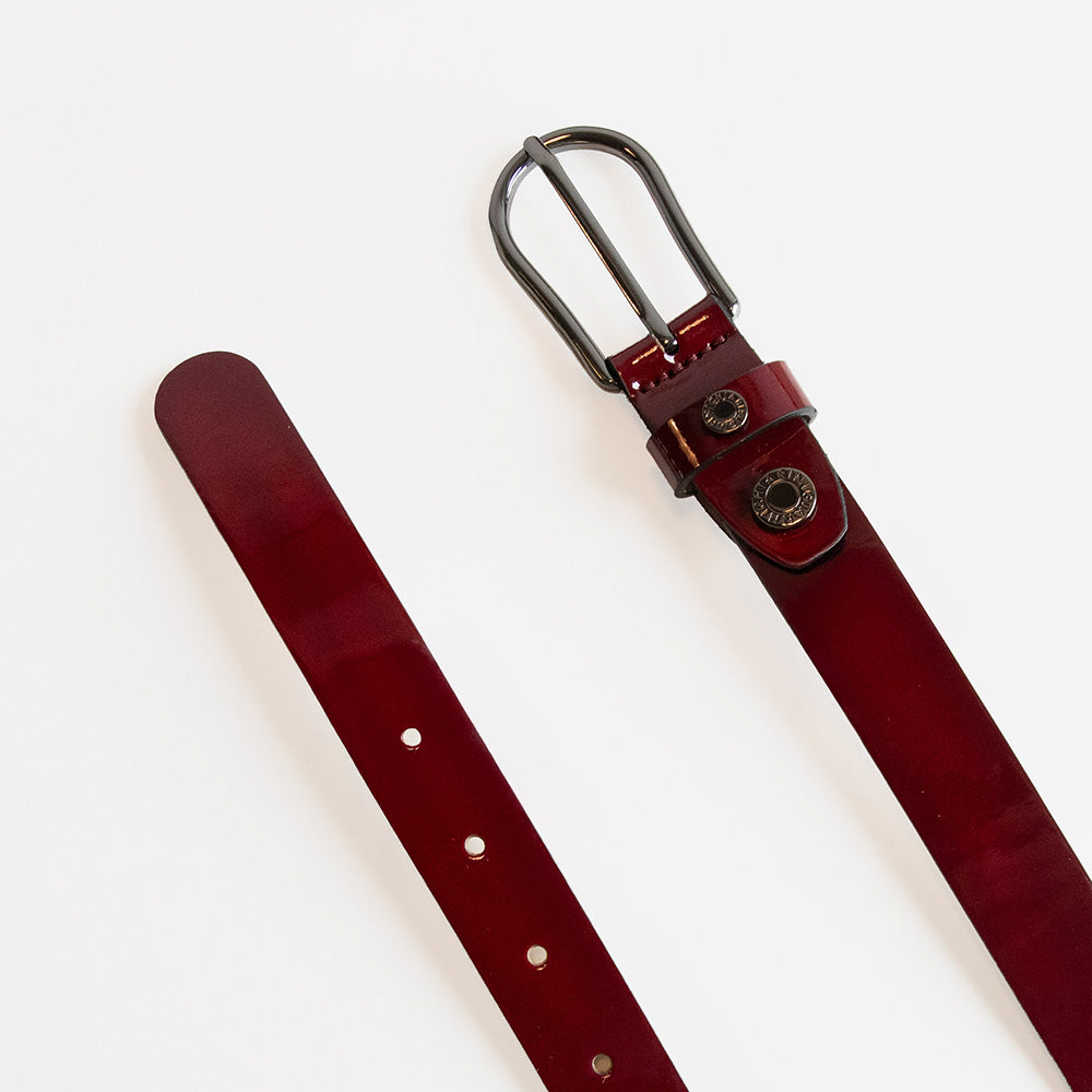 burgundy patent leather belt with silver buckle and stud