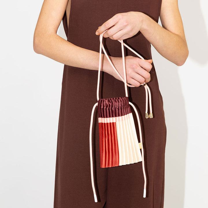 satin pleated mini crossbody bag in red, burgundy, cream & pink with cord adjustable strap