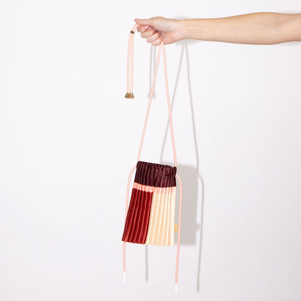 satin pleated mini crossbody bag in red, burgundy, cream & pink with cord adjustable strap