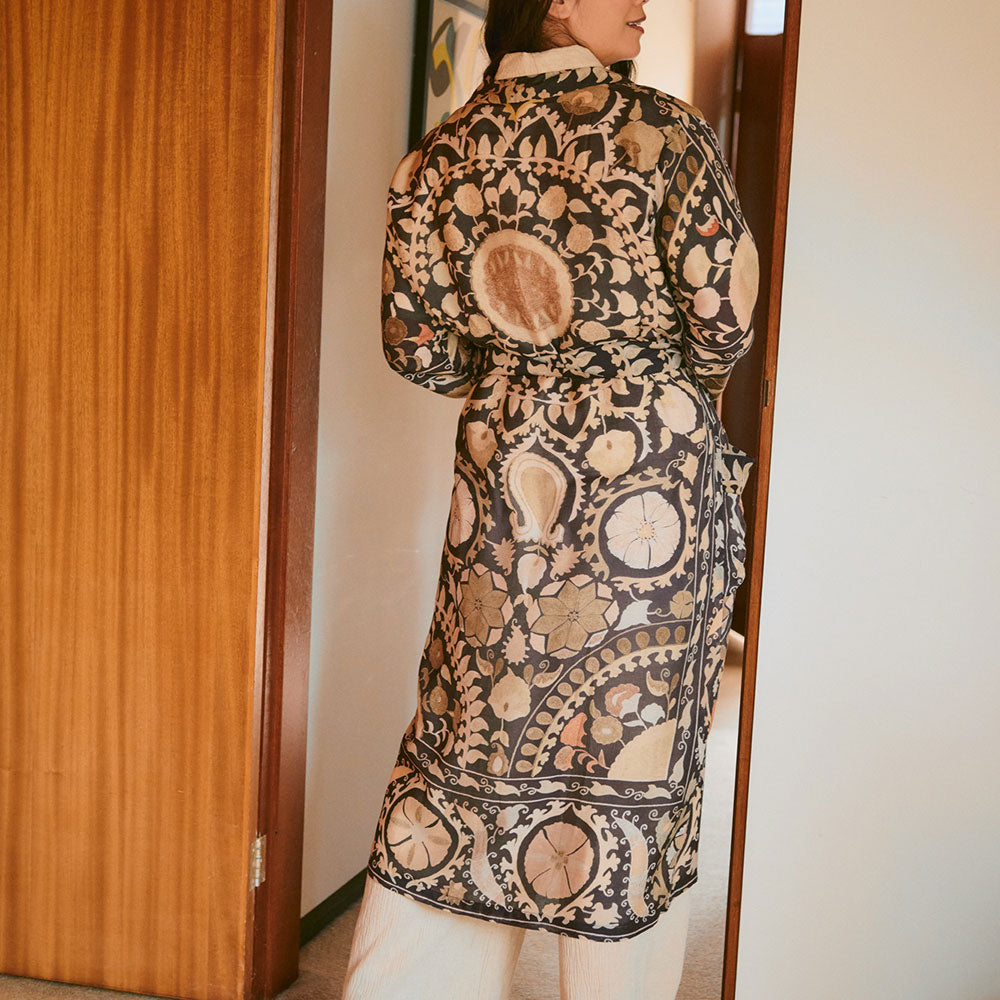 Person wearing a patterned dressing gown