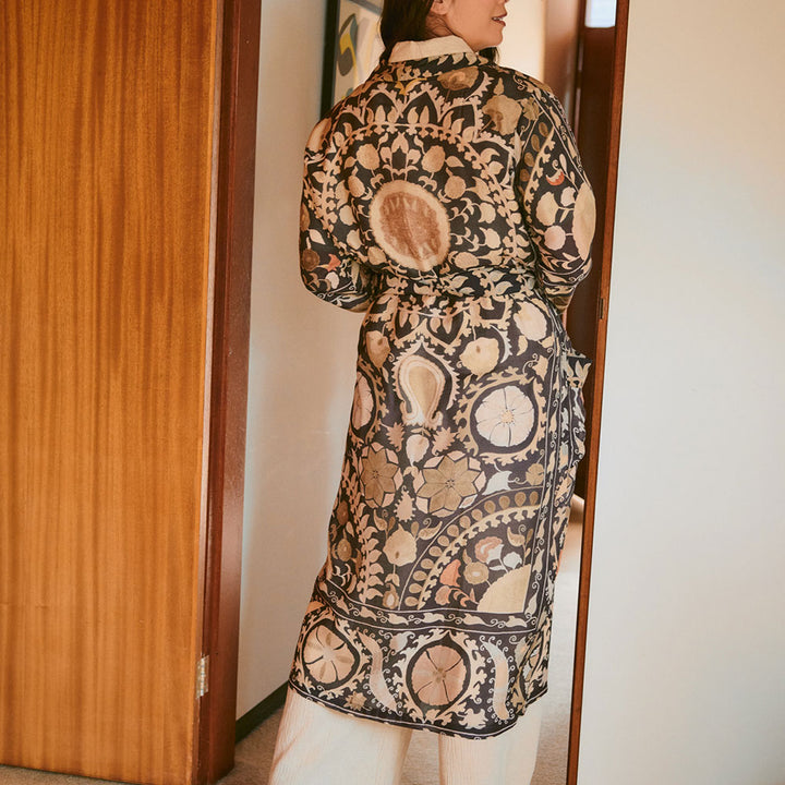 Person wearing a patterned dressing gown