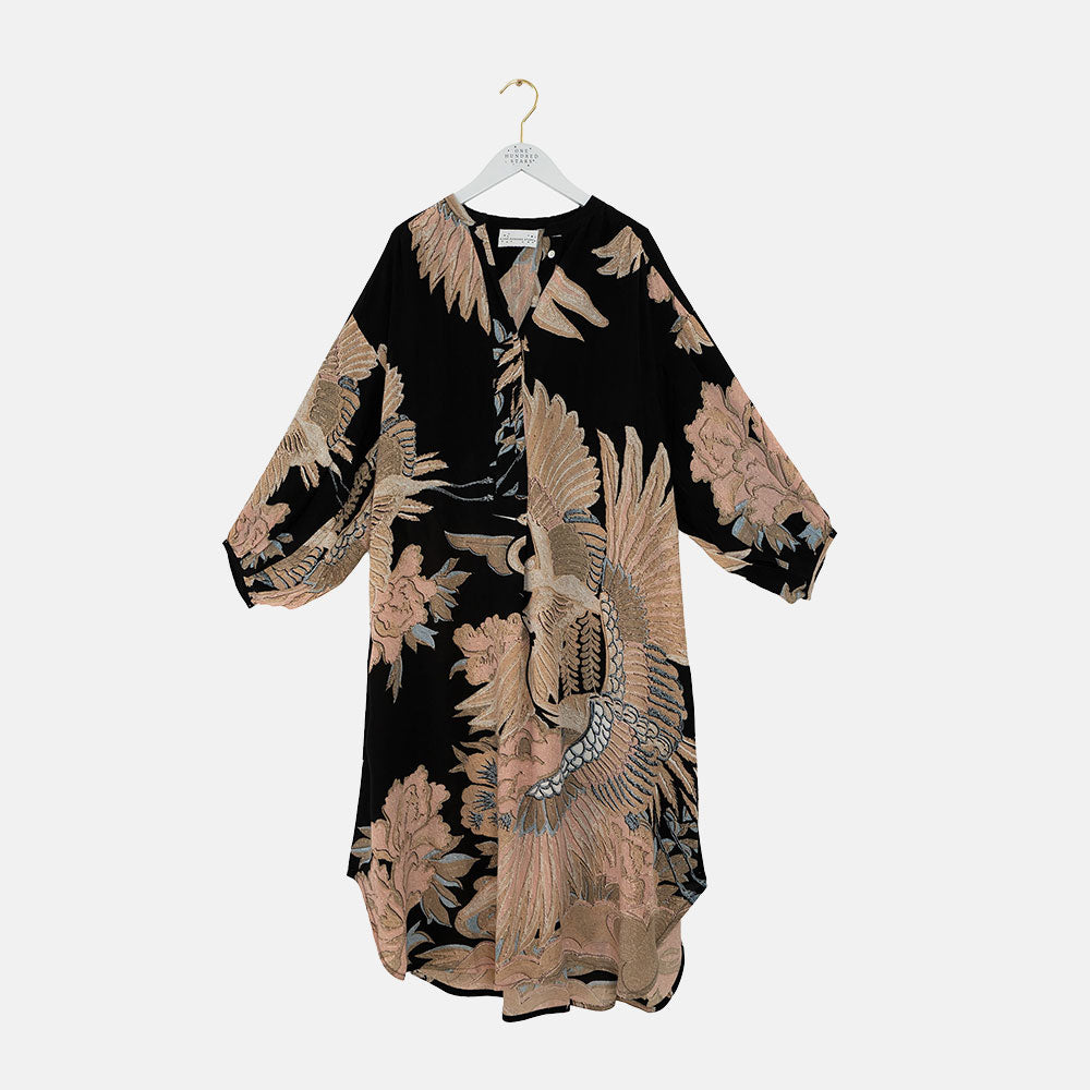 matt black crepe mid length dress with crane print in sand & light pink