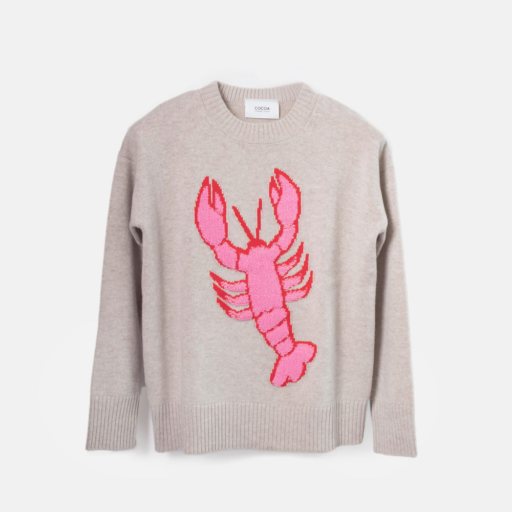sand coloured jumper with big pink lobster on the front