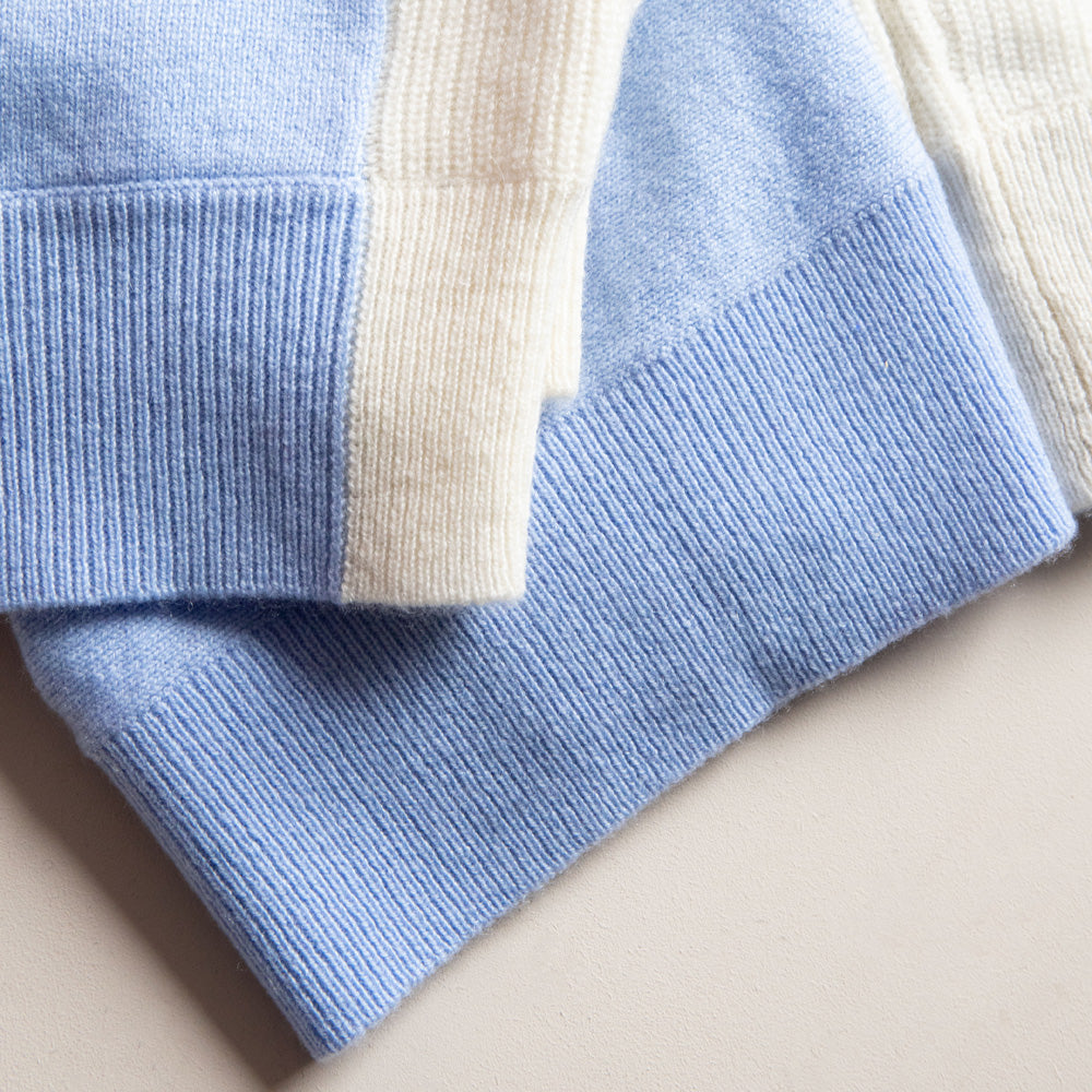Close-up of a blue and beige striped fabric on a beige background