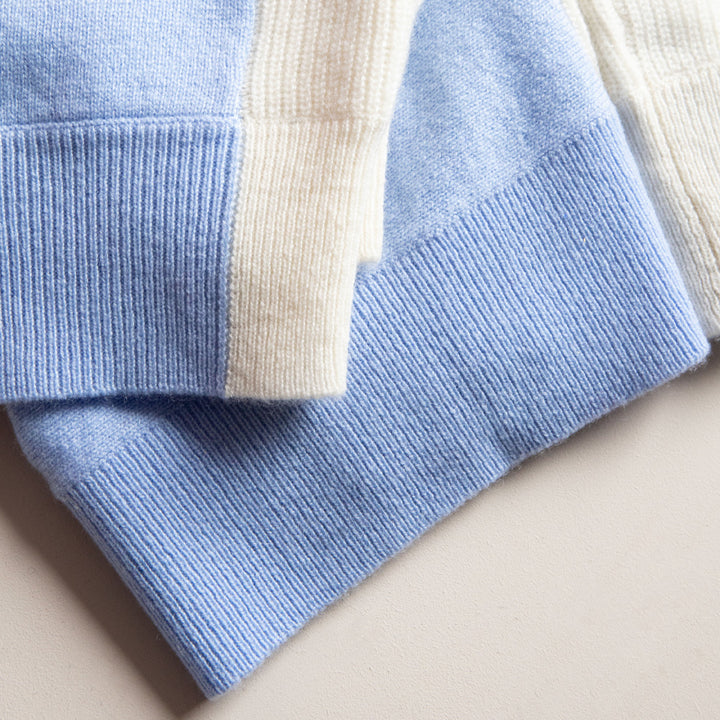 Close-up of a blue and beige striped fabric on a beige background
