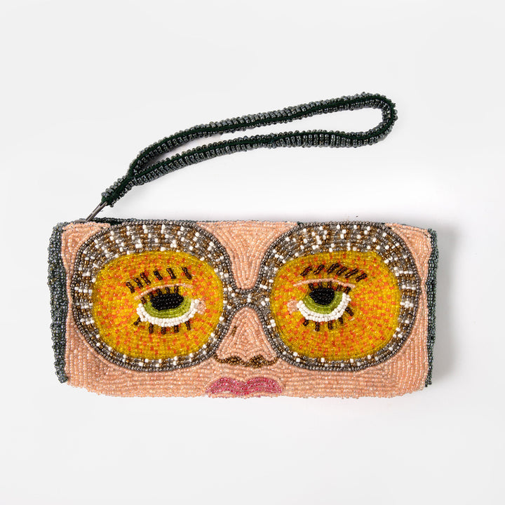 Beaded clutch or glasses case with eye design on a white background
