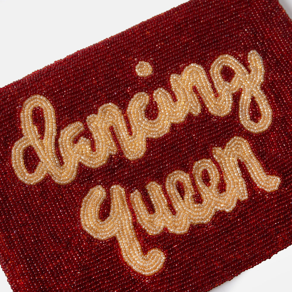 Red beaded clutch bag with 'Dancing Queen' text on a white background