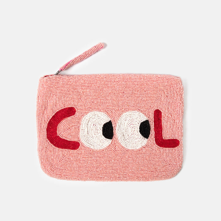 Pink beaded clutch bag with 'COOL' text on a white background