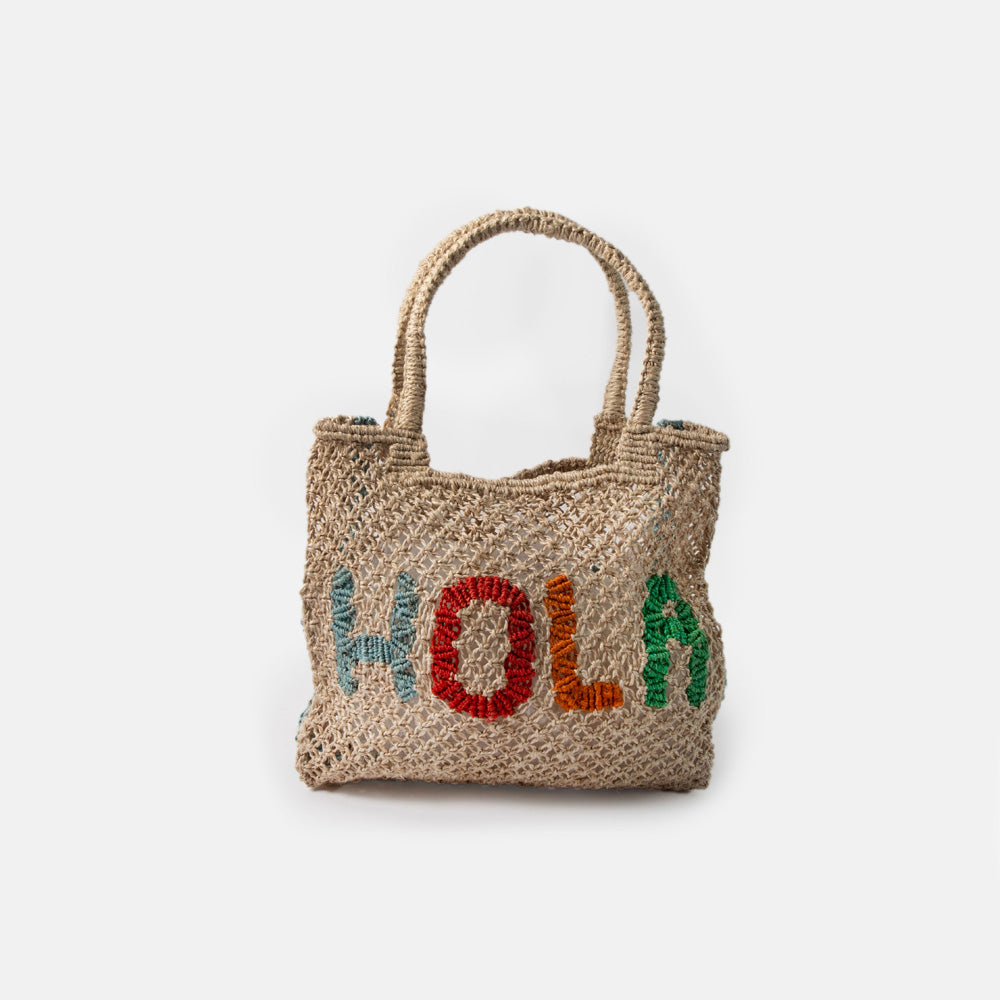 Woven jute shopper bag with 'Hola' text on a white background