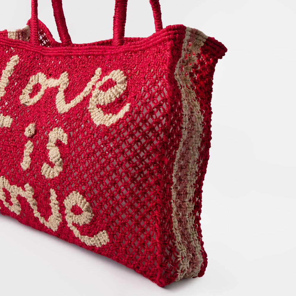 red jute shopper bag with the words love is love on a white background