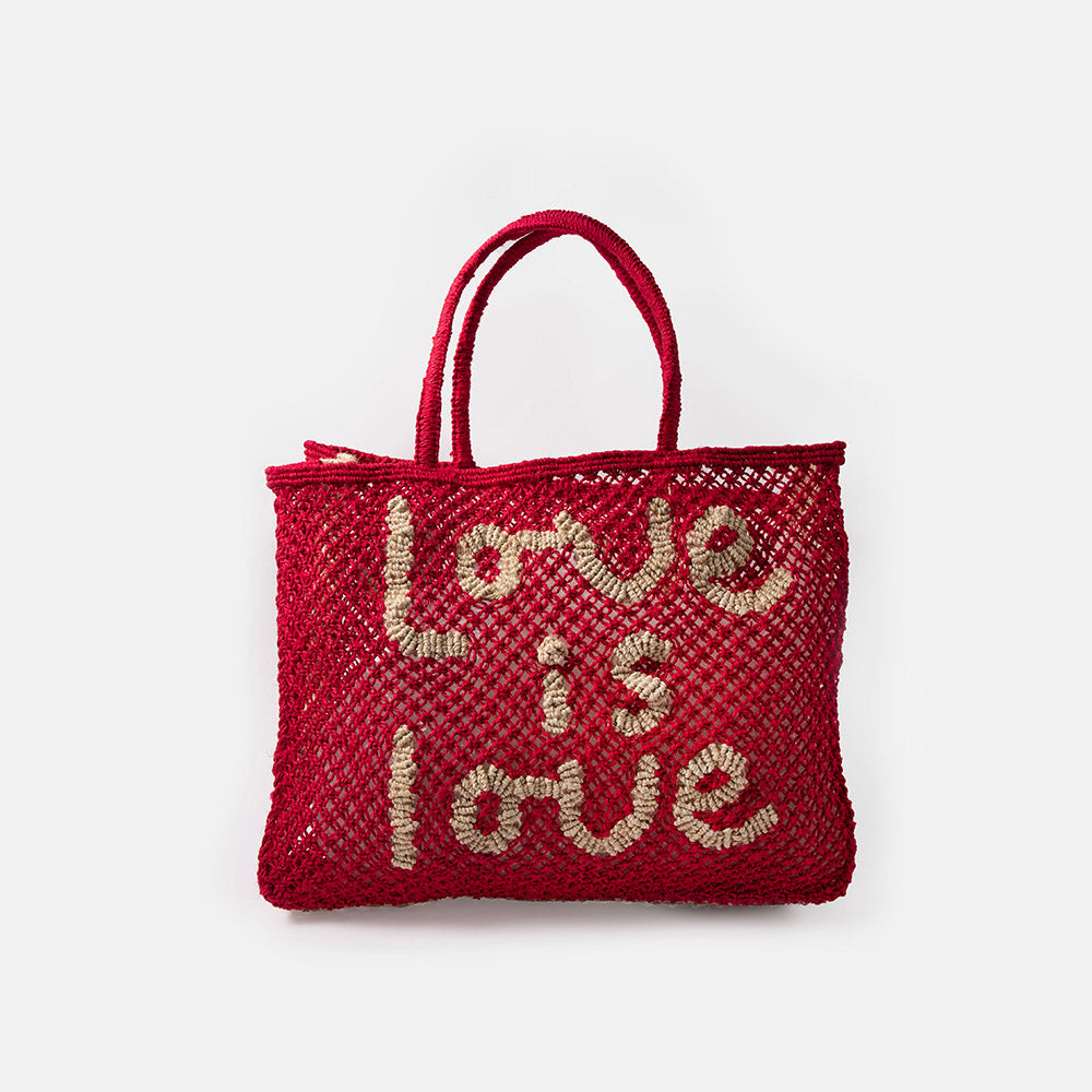 red jute shopper bag with the words love is love on a white background