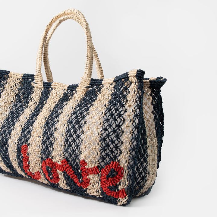 blue striped jute shopper bag with the word love in red, against a white background