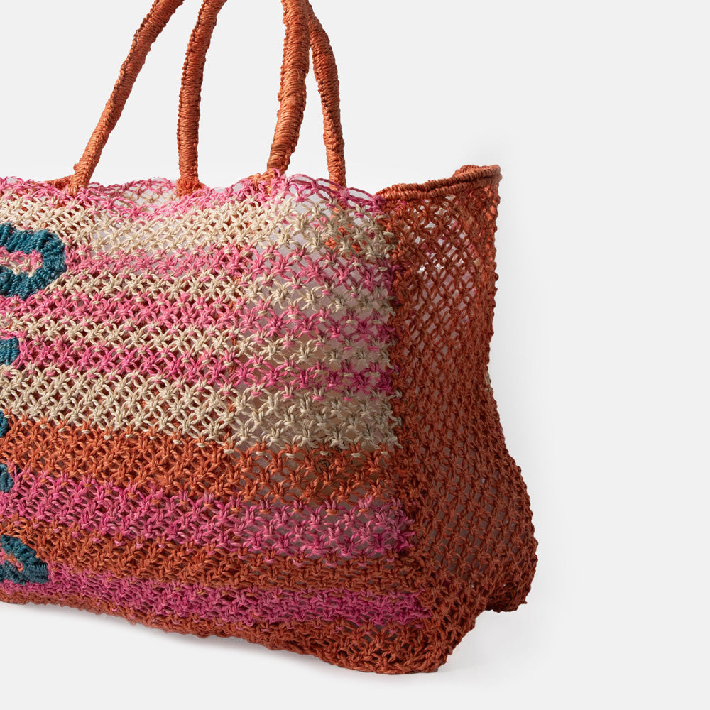 pink, orange & natural stripe jute shopper bag with the word 'ciao' in blue, against a white background