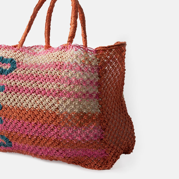 pink, orange & natural stripe jute shopper bag with the word 'ciao' in blue, against a white background