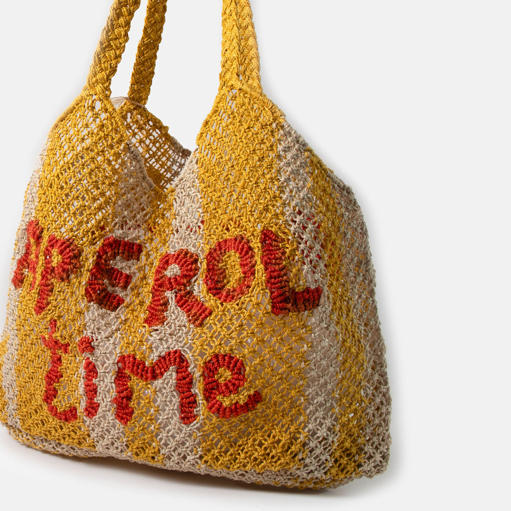 yellow stripe jute shopper bag with words 'aperol time' in red, against a white background