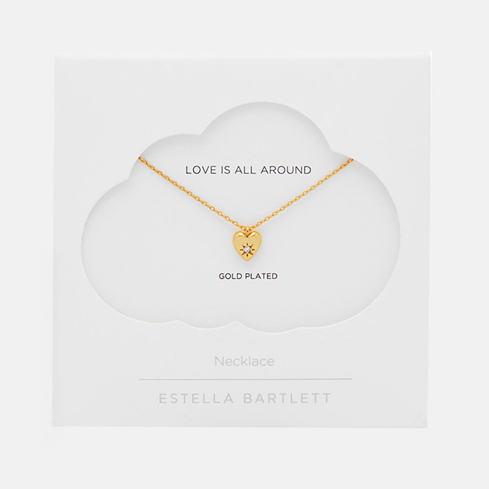 gold necklace with gold heart charm set with star shaped cubic zirconia in white packaging