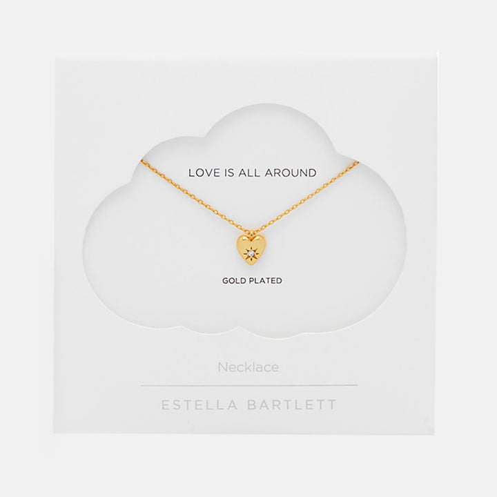 gold necklace with gold heart charm set with star shaped cubic zirconia in white packaging