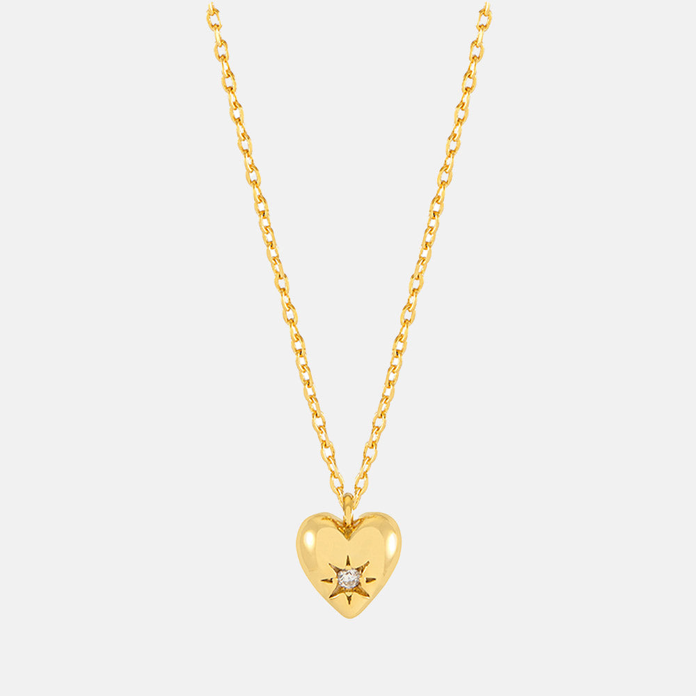 gold necklace with gold heart charm set with star shaped cubic zirconia