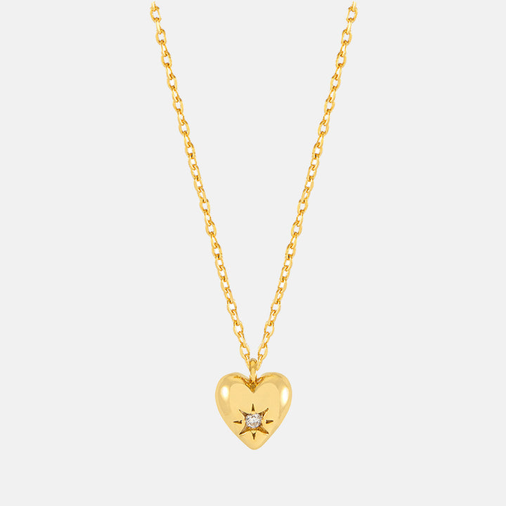 gold necklace with gold heart charm set with star shaped cubic zirconia