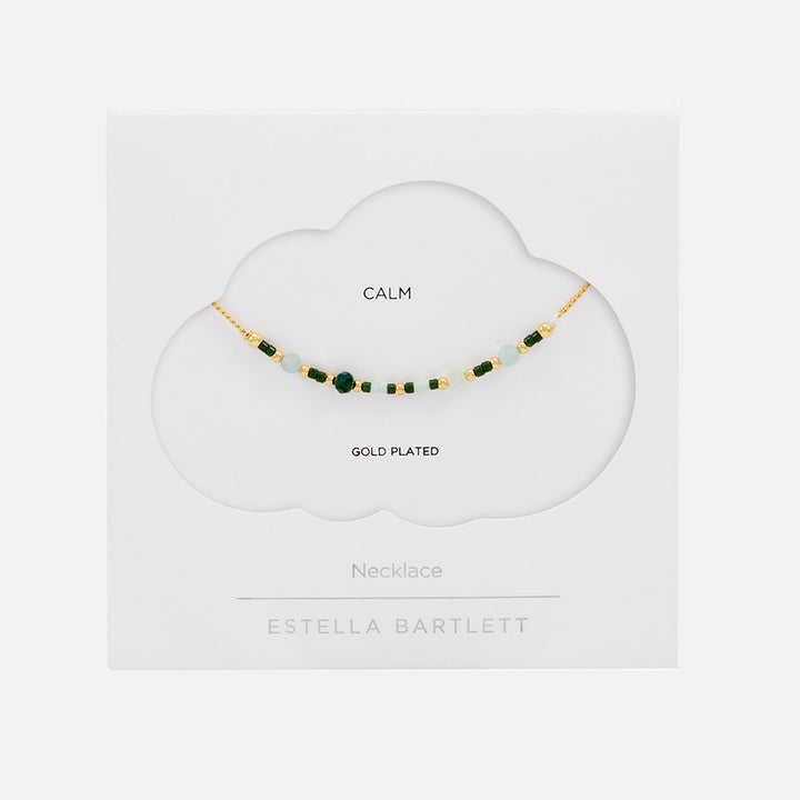 gold plated necklace with green enamel beads in white packaging