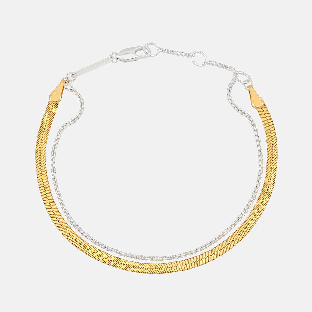 gold & silver double chain bracelet set on a white background