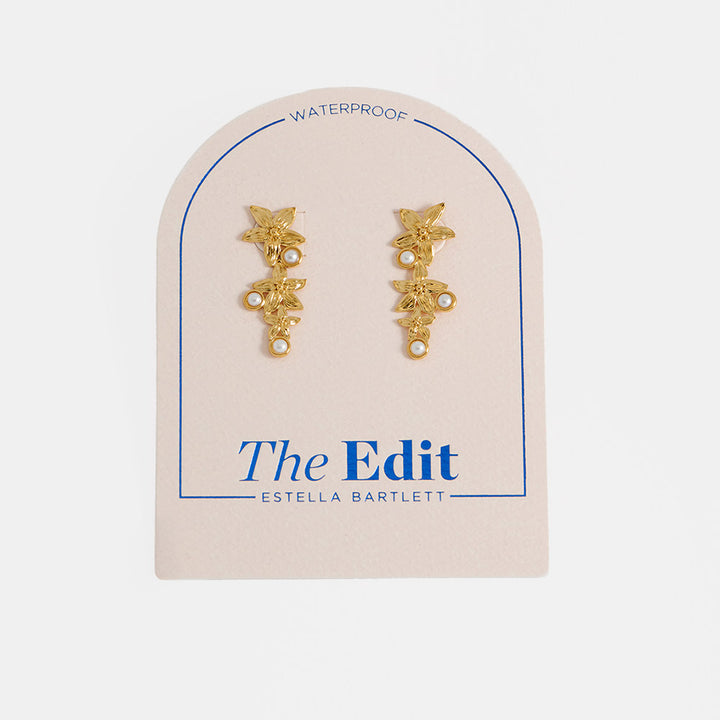 gold drop earrings with 3 flowers and 3 small pearls in estella bartlett branded packaging