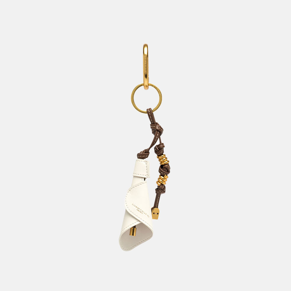 leather while lily bag charm with brown leather knots and gold metallic hardware