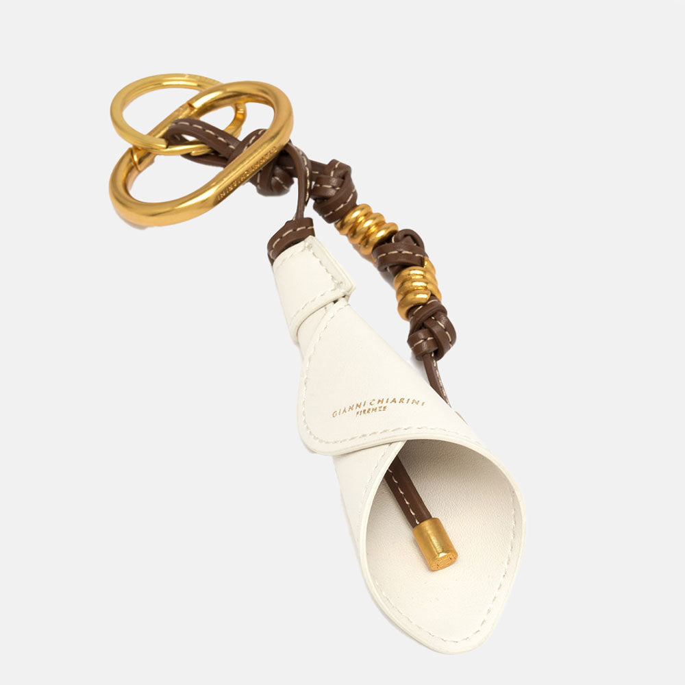 leather while lily bag charm with brown leather knots and gold metallic hardware