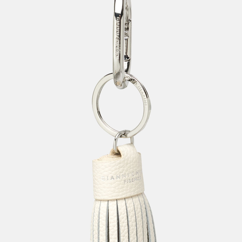 white, silver and brown tasselled leather bag charm with silver snap hook attachment 