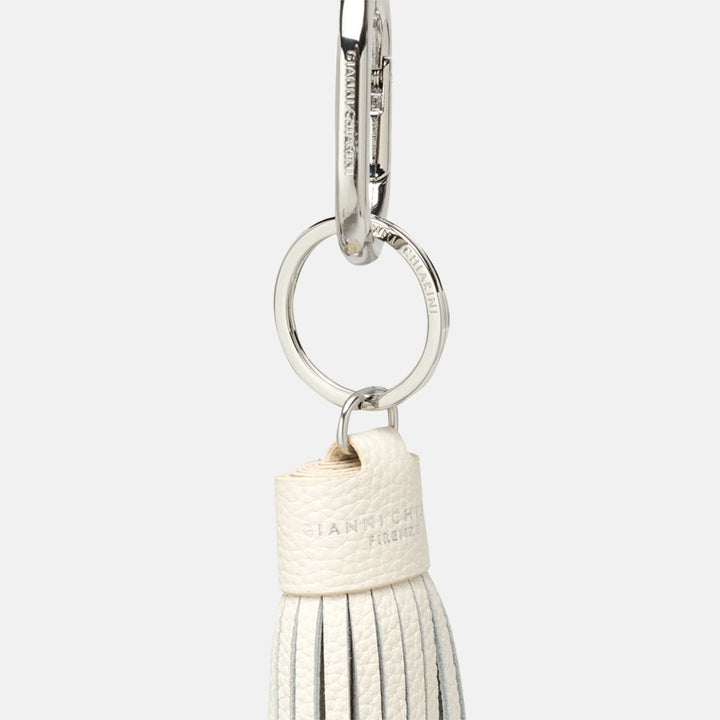 white, silver and brown tasselled leather bag charm with silver snap hook attachment 