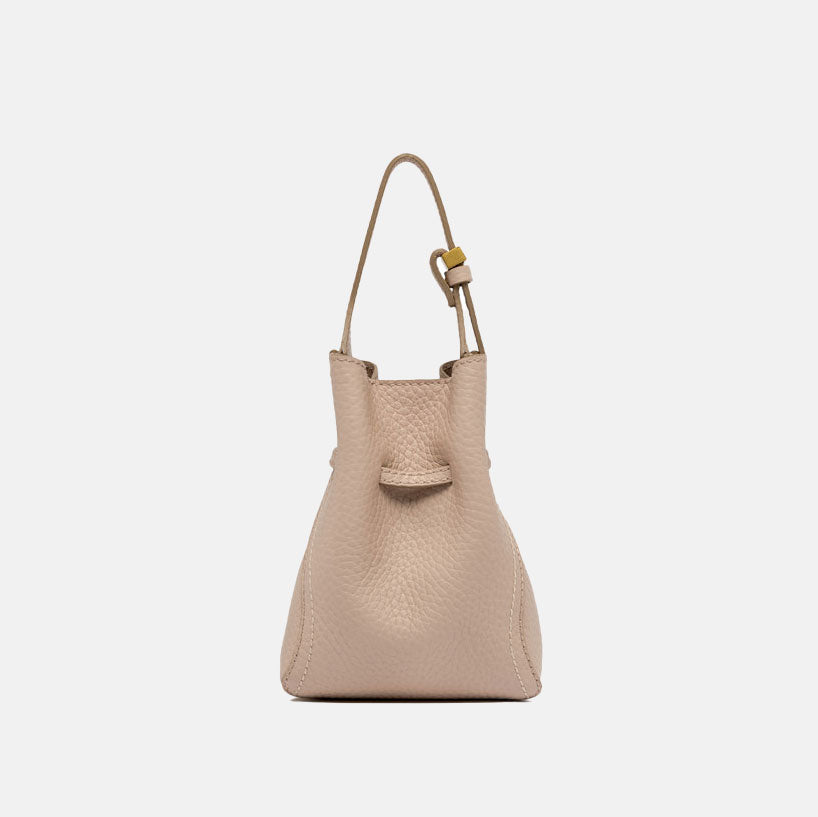 light pink leather bucket bag with adjustable strap