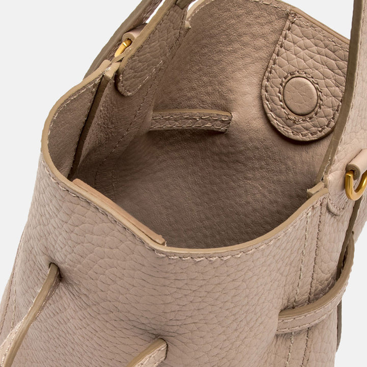 close up of inside of light pink leather bucket bag
