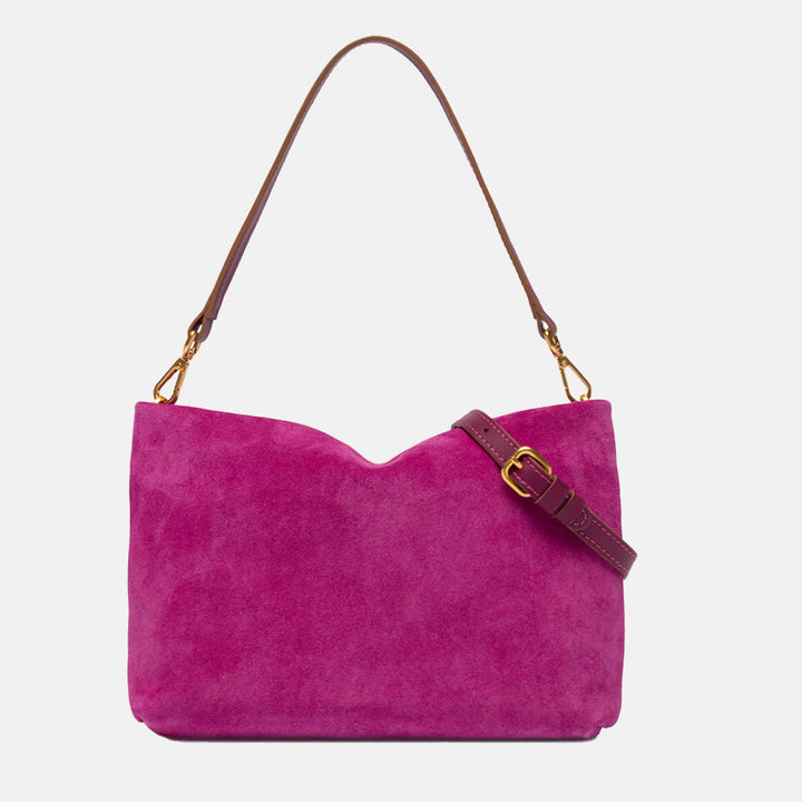 bright pink suede handbag with leather wrist and shoulder straps
