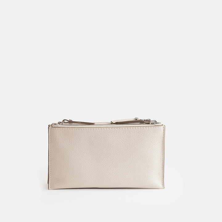 white leather envelope handbag on a light grey background