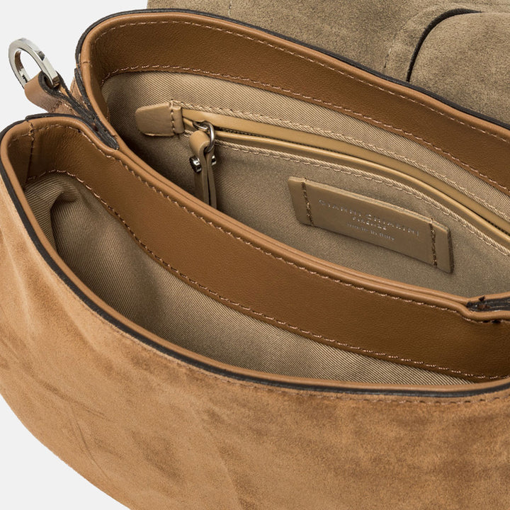 brown suede saddle bag with contrast stitching, silver & gold studs and leather shoulder and crossbody straps