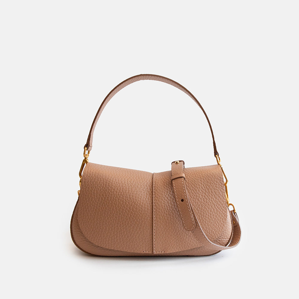brown leather handbag on a light grey background