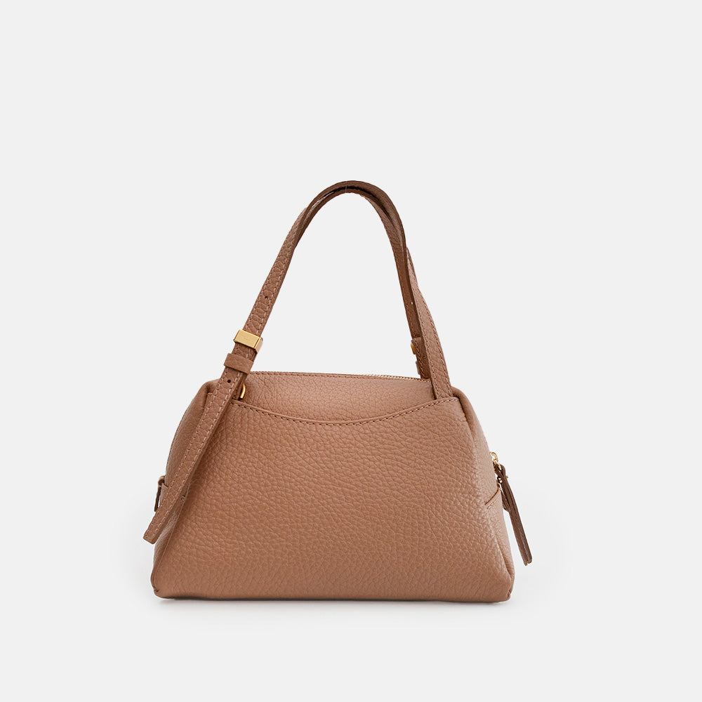 brown leather handbag on a light grey background