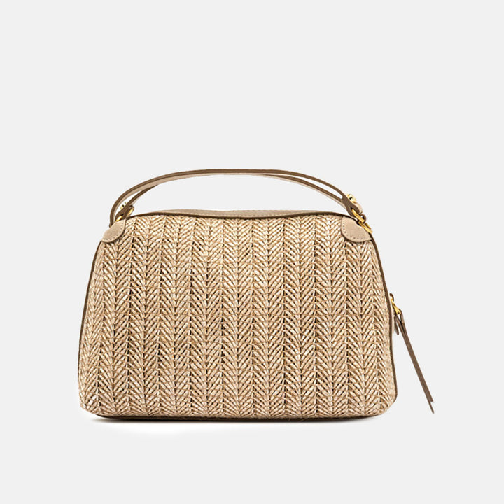 Woven handbag with a strap on a light grey background