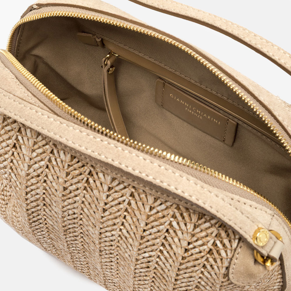 Woven handbag with a strap on a light grey background