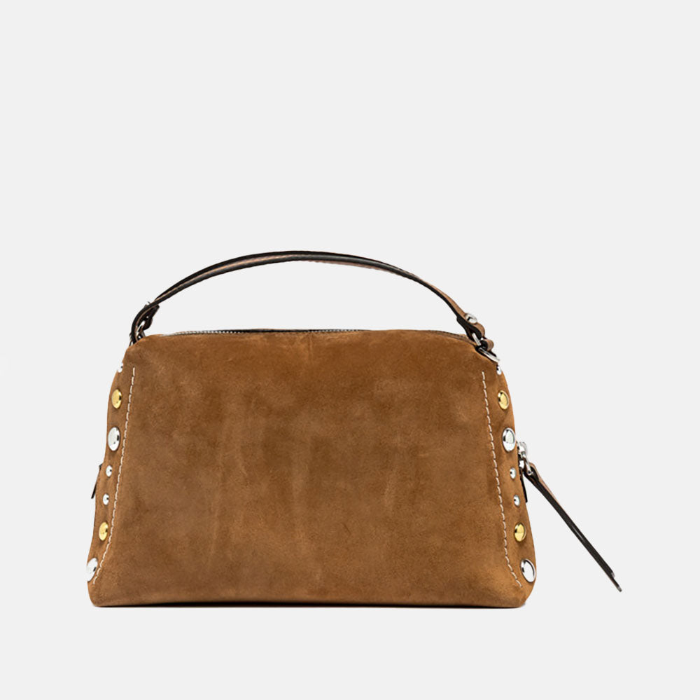 brown suede handbag with tonal grab handle and crossbody strap and studded with gold & silver studs