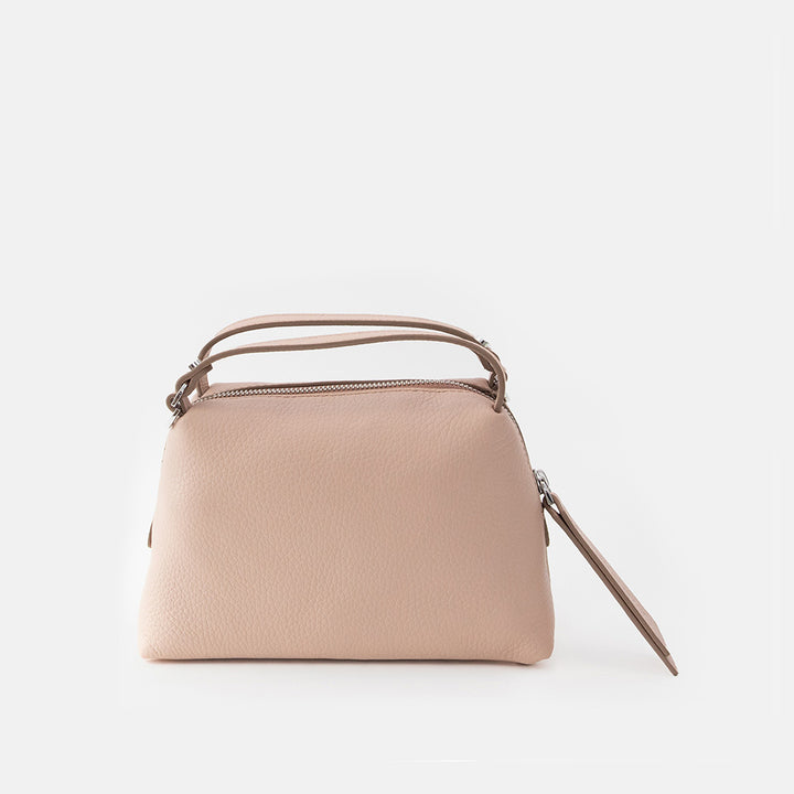 light pink leather handbag on a light grey background