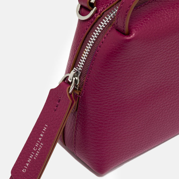 pink leather handbag with matching leather strap
