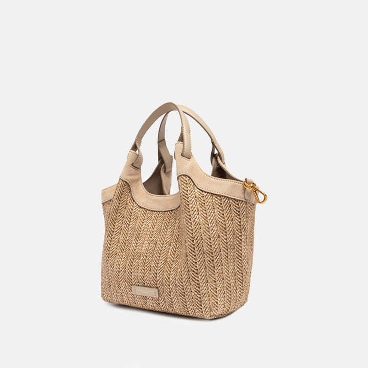 woven straw tote bag with tonal grab handles and  detachable adjustable leather shoulder strap