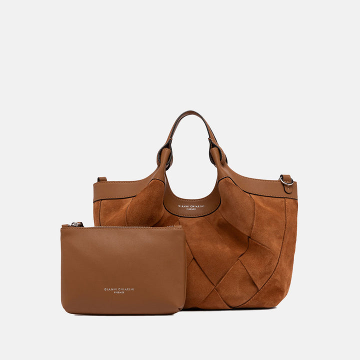 Brown woven chamois handbag with matching strap on a light grey background