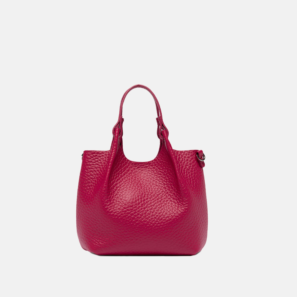 Pink handbag with matching strap on a white background