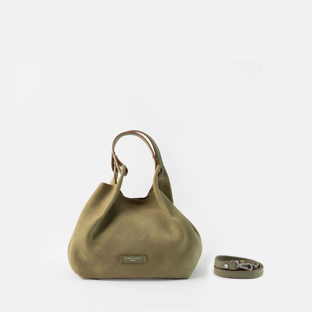 green suede bucket style handbag with green leather handle and crossbody strap. 