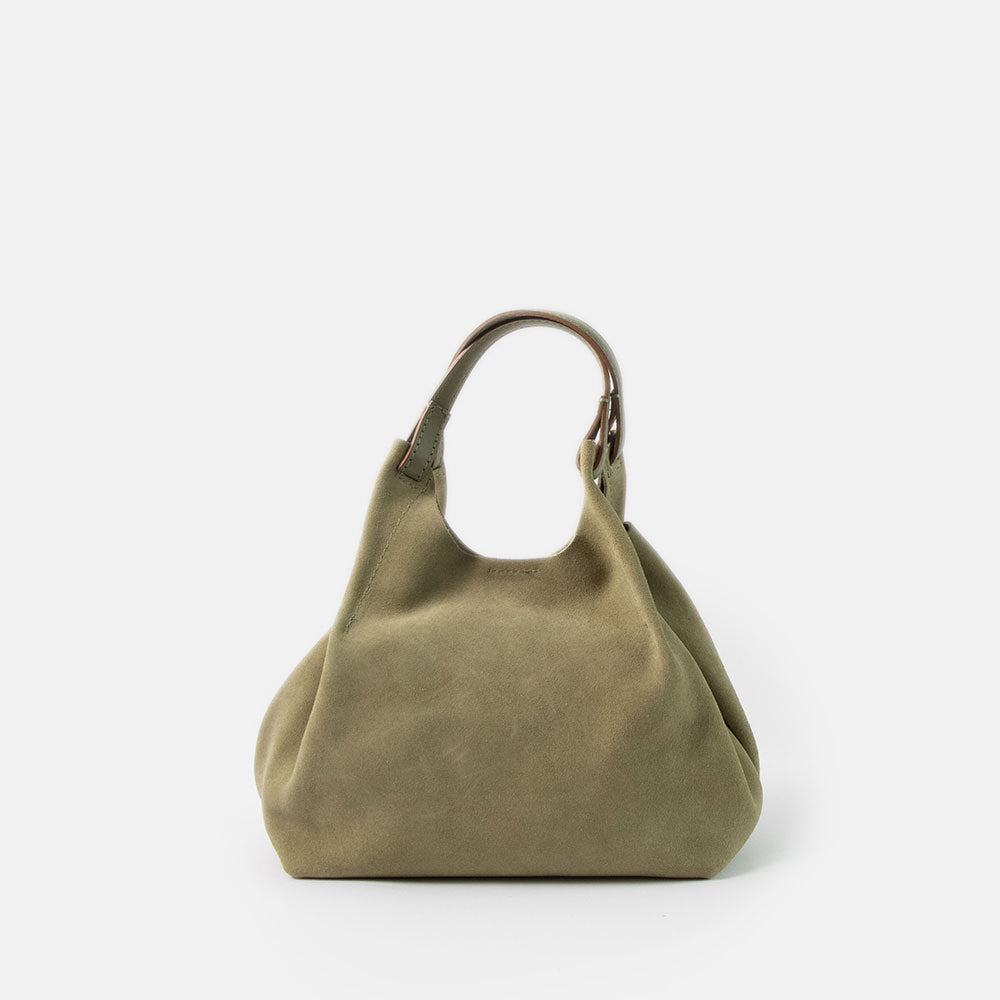 green suede bucket style handbag with green leather handle