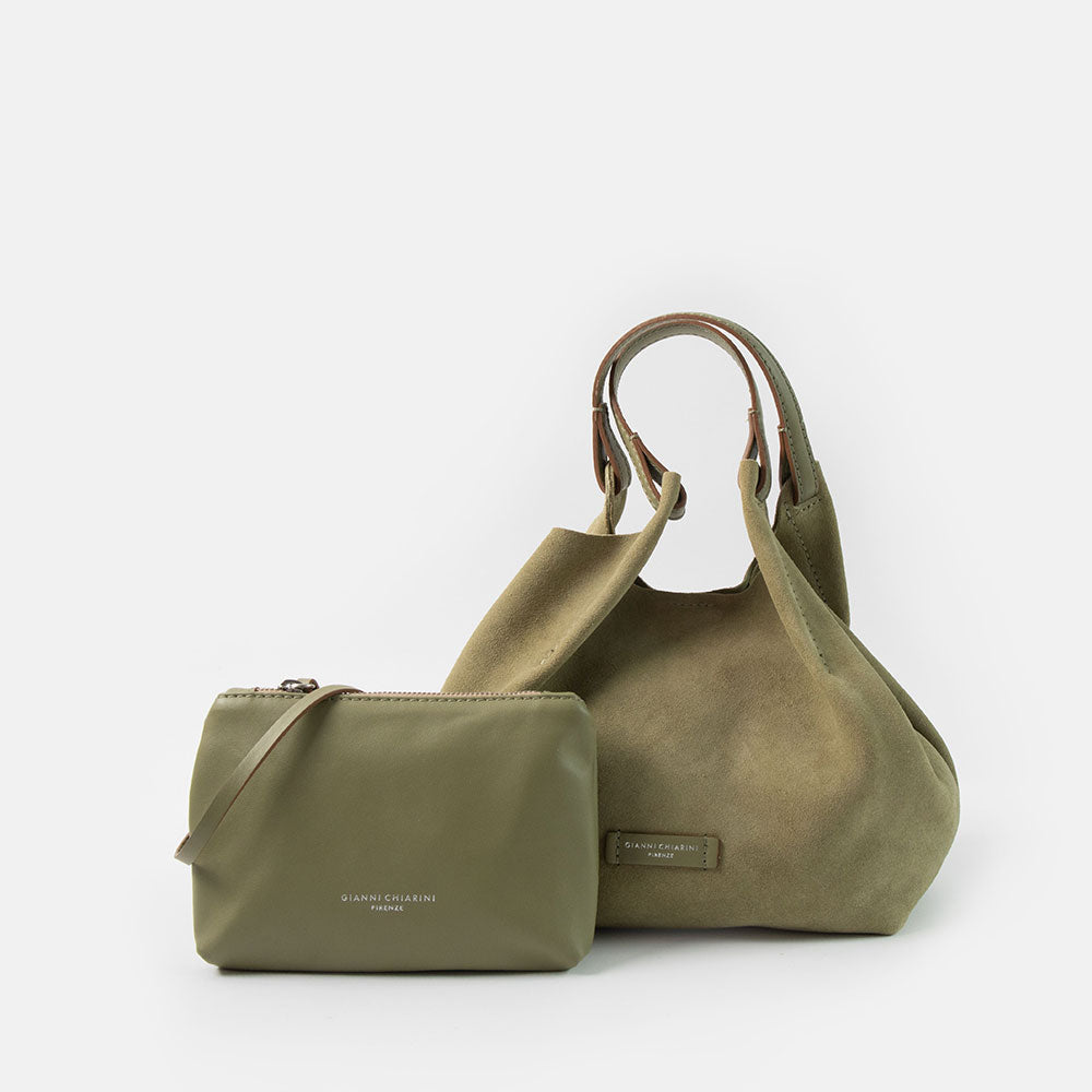 green suede bucket style handbag with green smooth leather clutch bag