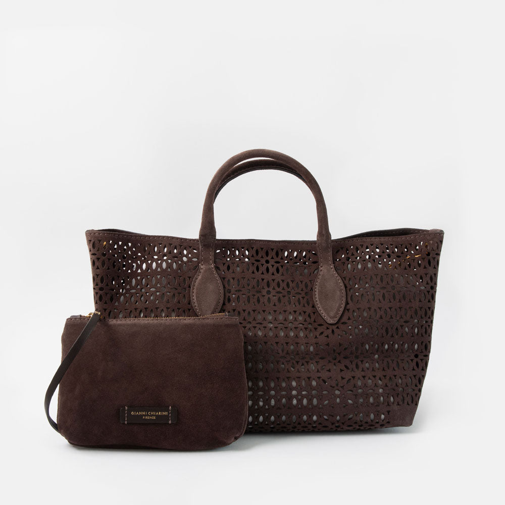 dark brown perforated suede handbag with brown leather grab handles and an accompanying brown suede clutch bag